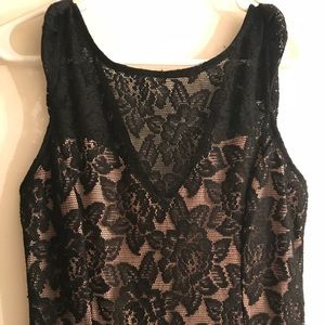 Cute pink dress with black lace overlay.